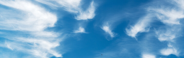 Beautiful blue sky with gentle white clouds. Aerial background view from of clear blue skies and white faint clouds
