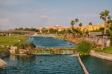 Great view of Channel and little bridge full of ducks Ballena Spain