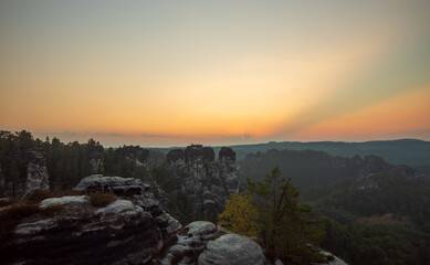 the sun rises at the elbsandsteingebirge