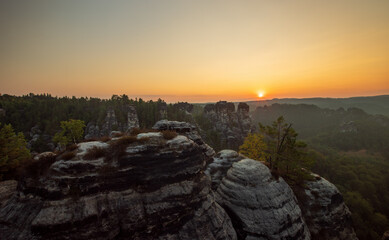 the sun rises at the elbsandsteingebirge