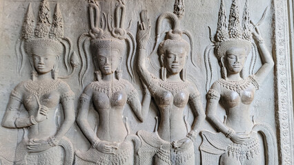 Wall carving of Khmer Culture in Ancient ruins Angkor Wat temple - famous Cambodian landmark. Siem Reap, Cambodia.