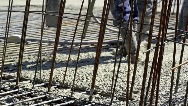 Pouring Concrete From Cement Mixer on Concreting Formwork - Slow Motion.. High Rise Concrete Pumping at Construction Site. Concreting Work by Construction Workers at Construction Site.