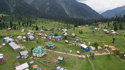 Aerial View of a Beautiful Countryside with mountains, meadows and forest