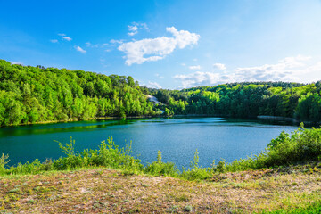 Jezioro Turkusowe near Wapnica. Lake in Wolin National Park in Poland. Idyllic landscape with green nature by the lake. Turquoise lake.   © Elly Miller