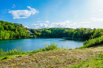 Jezioro Turkusowe near Wapnica. Lake in Wolin National Park in Poland. Idyllic landscape with green nature by the lake. Turquoise lake.   © Elly Miller