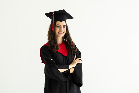 Full isolated studio picture from a young graduation woman on white background