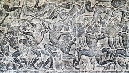 Wall carving of Khmer Culture in Ancient ruins Angkor Wat temple - famous Cambodian landmark. Siem...