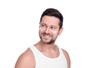 Handsome man with sun protection cream on his face against white background