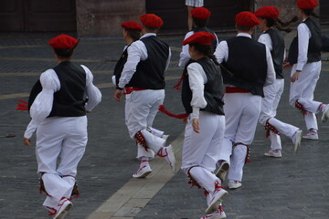 Basque folk dance exhibition in an outdoor festival
