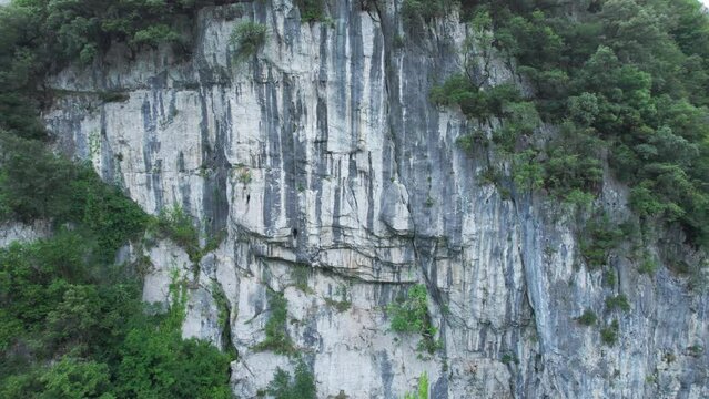 View of drone moving towards the back of an impressive rock climbing site in the town of lierganes, cantabria. Aerial shot drone 4k.