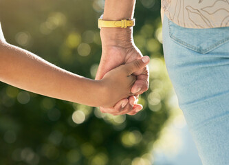 Holding hands, mother and daughter in closeup, outdoor and walking together with care, love or bonding, Mom, young kid and summer sunshine in garden, backyard or park for family, vacation and freedom