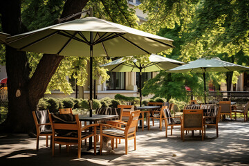 Restaurant, cafe, bar, terrace in the city in the shade and under of trees and parasols