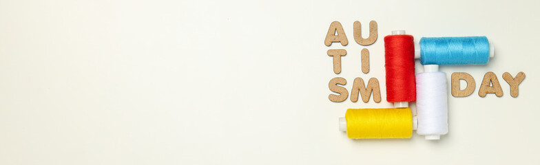 Multicolored threads with the word 