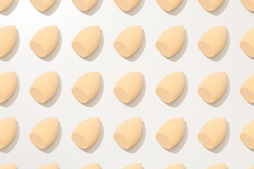 Cosmetic sponges on white background, top view