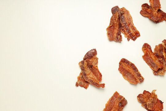 Tasty breakfast and delicious meat food concept - fried bacon