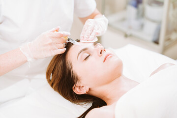 Obraz na płótnie Canvas Skin mesotherapy treatment for young woman in modern clinic