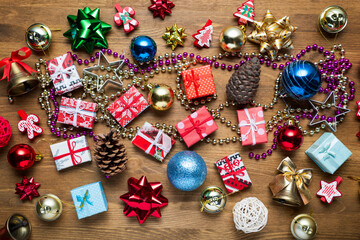 Fototapeta na wymiar Christmas tree decorations on wooden background, top view
