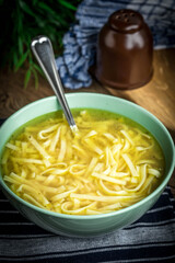 Broth - chicken soup in a bowl.