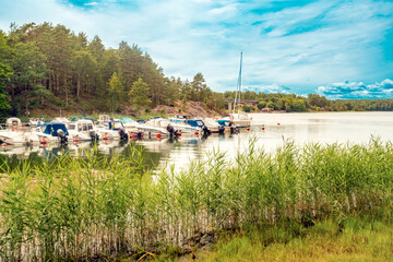 A lake with boats near Gamleby in the countryside in Kalmar, Sweden © TambolyPhotodesign