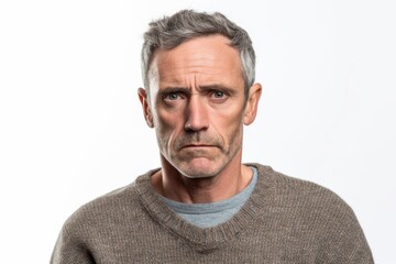 Obraz premium Group portrait photography of a man in his 40s with furrowed brows and a tense expression due to hypertension wearing a cozy sweater against a white background 