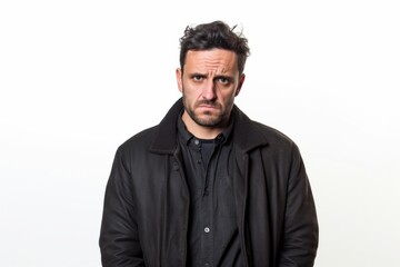 Medium shot portrait photography of a man in his 30s with a pained and tired expression due to fibromyalgia wearing a chic cardigan against a white background 