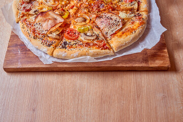 Home made, hot and organic Italian pizza on table. Mamma mia.