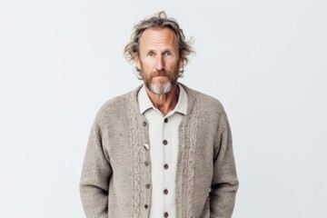 Obraz premium Medium shot portrait photography of a man in his 40s appearing tired and down due to hypothyroidism wearing a chic cardigan against a white background 