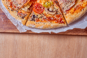 Home made, hot and organic Italian pizza on table. Mamma mia.