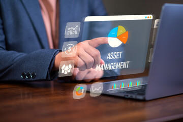 Asset management concept, Man using laptop with word asset management and Icon  on virtual display. Financial Property Digital assets.