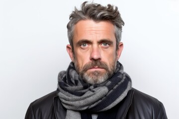 Medium shot portrait photography of a man in his 40s showing tiredness and a worn-down expression due to chronic fatigue syndrome wearing a charming scarf against a white background 