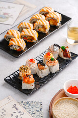 sushi is a Japanese dish of prepared vinegared rice, usually with some sugar and salt, accompanied by a variety of ingredients such as seafood, often raw and vegetables.