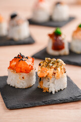 sushi is a Japanese dish of prepared vinegared rice, usually with some sugar and salt, accompanied by a variety of ingredients such as seafood, often raw and vegetables.