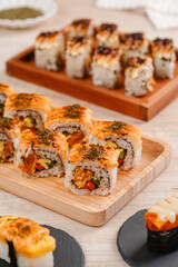 sushi is a Japanese dish of prepared vinegared rice, usually with some sugar and salt, accompanied by a variety of ingredients such as seafood, often raw and vegetables.