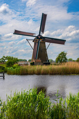 View of traditional windmills and canals in Kinderdijk Village in the Netherlands, South Holland....
