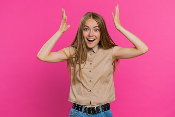 Excited amazed woman touching head and showing explosion, looking worried and shocked, celebrating success idea. Looking surprised of win wow blonde girl isolated alone on pink studio background - obrazy, fototapety, plakaty