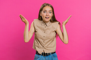 What Why. Sincere irritated young woman raising hands in indignant expression, ask reason of...