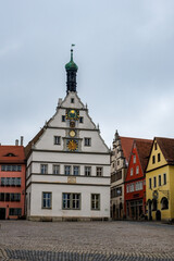 Colourful street on a main square of Rothenburg ob der Tauber, the Franconia region of Bavaria, Germany. Medieval old town. The most romantic town in Germany.