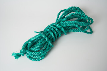 green plastic rope on white background