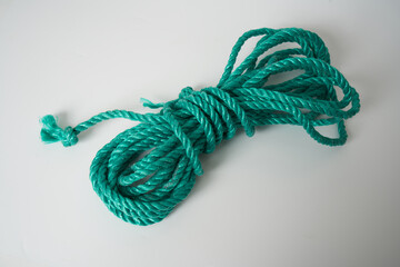 green plastic rope on white background