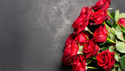 Bouquet of red roses on a black background. Top view