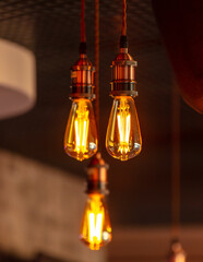 Decorative antique edison style filament light bulbs hanging from ceiling