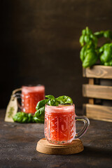 watermelon drink with basil on a dark background