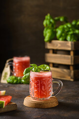 watermelon drink with basil on a dark background