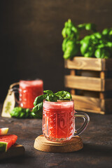 watermelon drink with basil on a dark background