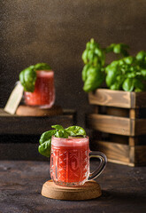 watermelon drink with basil on a dark background