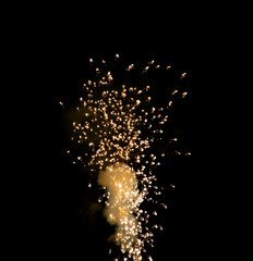sparks from fireworks on a black background.