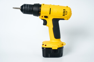 Black and yellow cordless drill on a white isolated background.