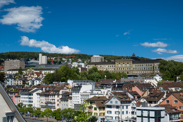 Fototapeta na wymiar Picturesque view of Zurich city Switzerland. Hillside, old town, sunny summer day, blue sky, ETH university in the background