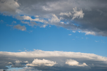 Beautifully puffy summer clouds against blue sky background, taken witha  polarized lens.