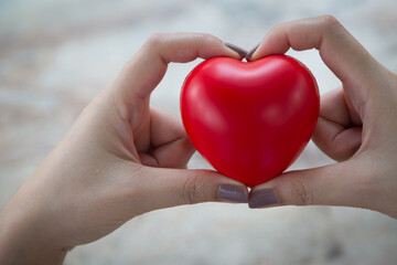 Woman hold red heart